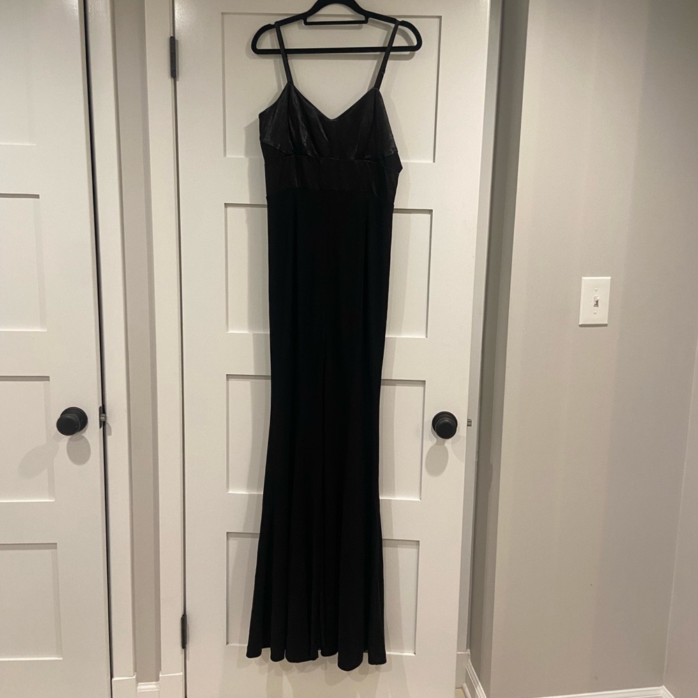 Black metallic maxi dress with mesh side cutouts and slit